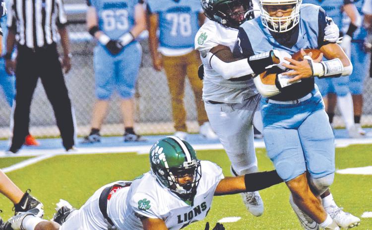 The Franklin County Lion defense, pictured in action against Johnson of Gainesville earlier this season, will look to hold down a powerful Prince Avenue Wolverines team Friday night in Bogart.