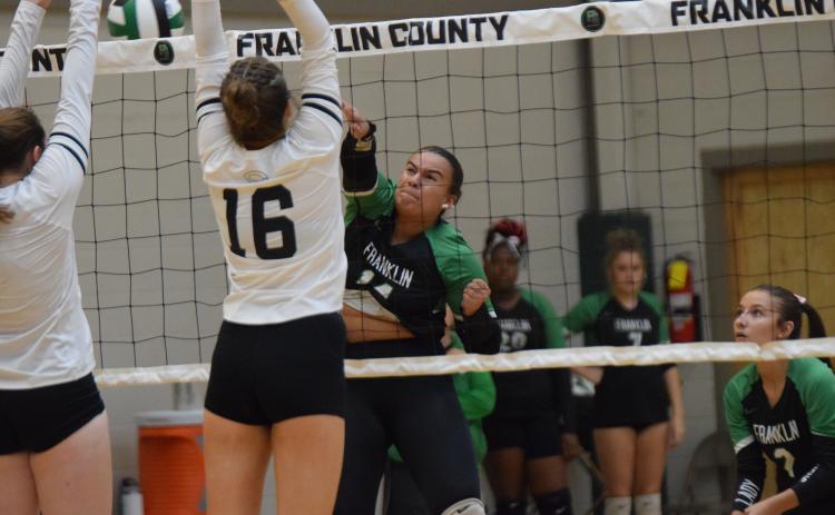 Kallie Thrift smashes the ball in action Thursday against Commerce at Rocky Ford Park.