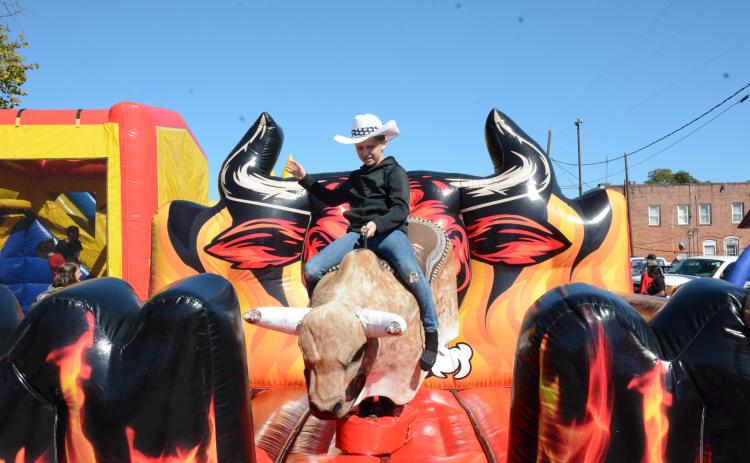 Trenton Sorrows brought his cowboy hat and jeans to take on a bucking bull Saturday at the Royston Fall Festival.