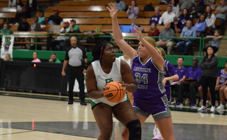 Ta’Kiyah Merriett looks for a shot in the season-opener Tuesday against Cherokee Bluff. (Photo by Scoggins)