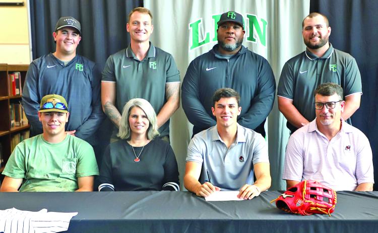 Franklin County Lion senior Ty Peeples signed Friday to play for the Georgia Bulldogs’ baseball team next year. Pictured at his signing are (front, from left) brother A.J. Peeples, mom Kim Peeples, Ty, dad Tod Peeples, (back) Lion baseball coaches Duncan Beasley, Drew Phillip, Demond Rivers and head coach Ryan Phillips.