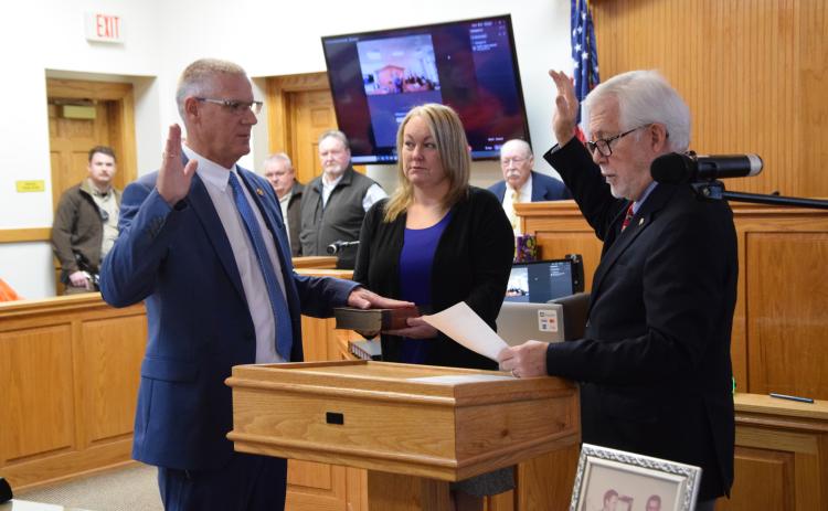 Franklin County Sheriff-elect Scott Andrews (left) was sworn in to the post in a ceremony Friday at the Franklin County Courthouse.