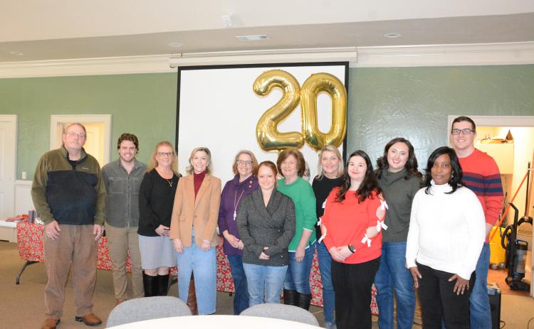 Harmony House staff and board members attending Thursday’s 20th anniversary celebration were (from left) James Williams, Walker Rice, Regina Hooper, Laurie Whitworth, Wendy Risner, Kayla Farmer, Sydney Jordan, Jennifer Rainer, Kaitlin Andrews, Olivia Owensby, Kimberly Brewer and Darrin Haley.  (Photo by Eavenson)