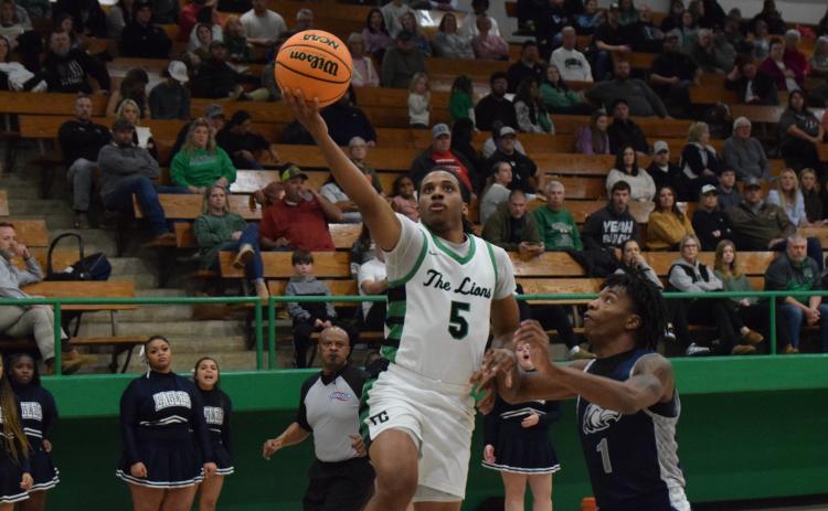 Frae’Quane Wilkins goes up for a layup during the Franklin County Lions’ victory Friday over East Jackson in the Lion’s Den. (Photo by Scoggins)