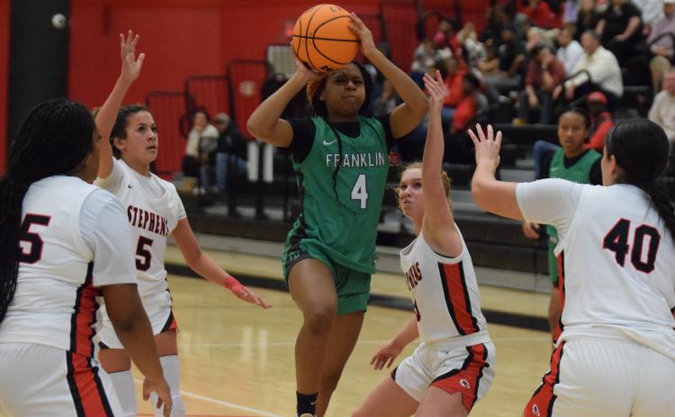 Nykhia Johnson puts up a shot against Stephens County Tuesday in Toccoa. Johnson finished with 20 points to lead the Franklin County Lady Lions.