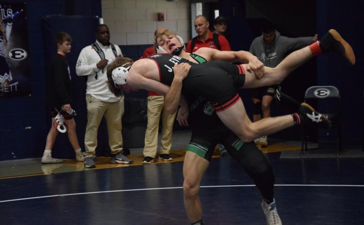 Franklin County Lion Josh Baughcum picks up an opponent for a takedown during action Saturday in the Inferno Invitational in Elberton. (Photo by Scoggins)