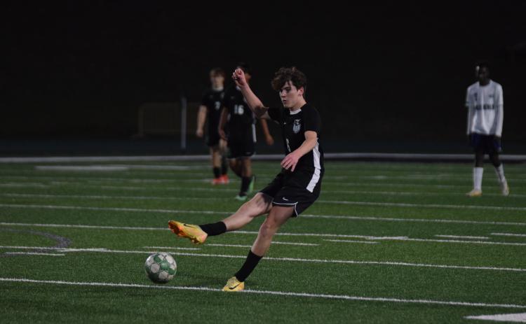 Midfielder Reese Fowler takes a free kick in a game earlier this season for the Franklin County Lions.