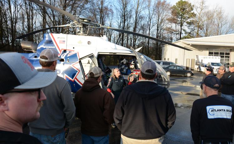 The volunteer fire departments for Carnesville and Red Hill came together Monday for training on how to deal with helicopter medical transport from the scene of a medical emergency.