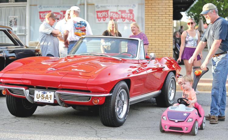 ROYSTON – Cut A Block Friday in Royston turned out to be a great time for car lovers of all ages and man’s best friend too. The second annual event drew a large crowd to downtown Royston for a night of classic cars, memories and good music, including the christening of the new concert stage at The Royce, by singer Aaron Tanner. For more photos and information on the event, see Page 16. (Photos by Rose Scoggins)
