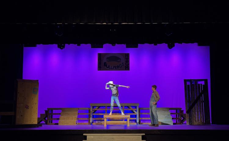 Brock Fowler (left), as Ren, dances as Taylor Haley, as Willard, watches in a scene from “Footloose, The Musical,” which will be on stage at the Telford Center for the Fine and Performing Arts beginning tonight.
