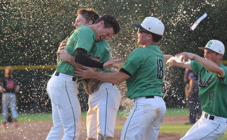 Franklin County Lions Ty Peeples, Will Dodd, Colby Cape and Eli Moore (above) celebrate after the team defeated No. 1-ranked Morgan County on the road last week in the state semifinals.