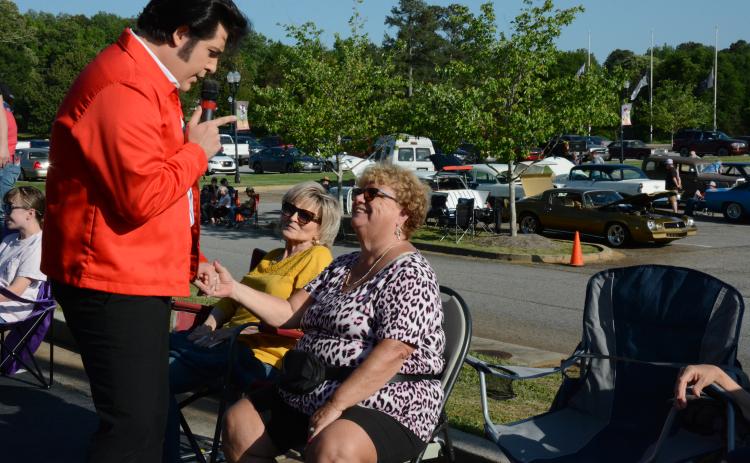 Austin Irby, a.k.a. Elvis, greets two of his biggest fans at Saturday’s Rhythm & Rides event in Franklin Springs. Ann Reviere (left) and Judy Fields (right) said they are huge fans of Elvis and Irby.