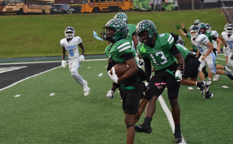 Gavin Wells celebrates with teammate Jeremiah Mayfield on his way to the end zone for a touchdown.