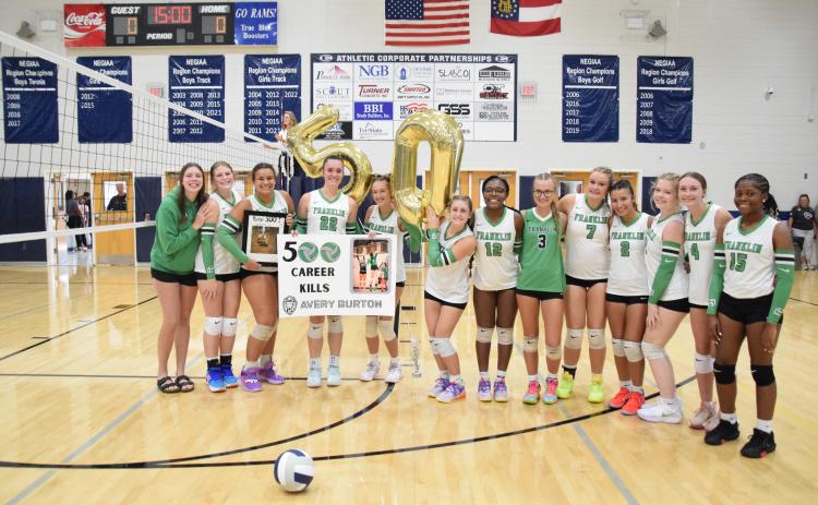 ELBERTON – Members of the Franklin County Lady Lion volleyball team took time out during a game Tuesday against Rabun County in Elberton to congratulate junior Avery Burton for her 500th career kill. The team went on to defeat Rabun County and Elbert County. For complete details, see Page 11. (Photo by Shane Scoggins)