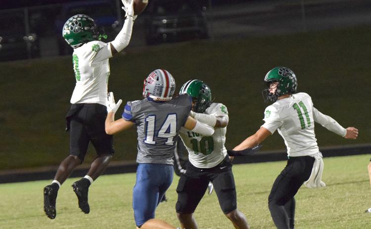 Jeremiah Mayfield leaps for an interception that he would return 65 yards for a touchdown against West-Oak Friday in Westminster, S.C. (Photos by Shane Scoggins)