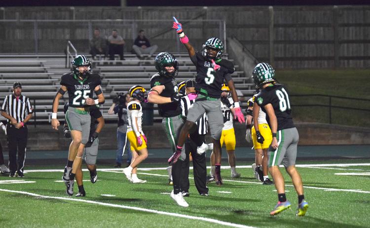 Gavin Wells celebrates after recovering a fumble on a punt for the Franklin County Lions against Prince Avenue. (Photo by Shane Scoggins)