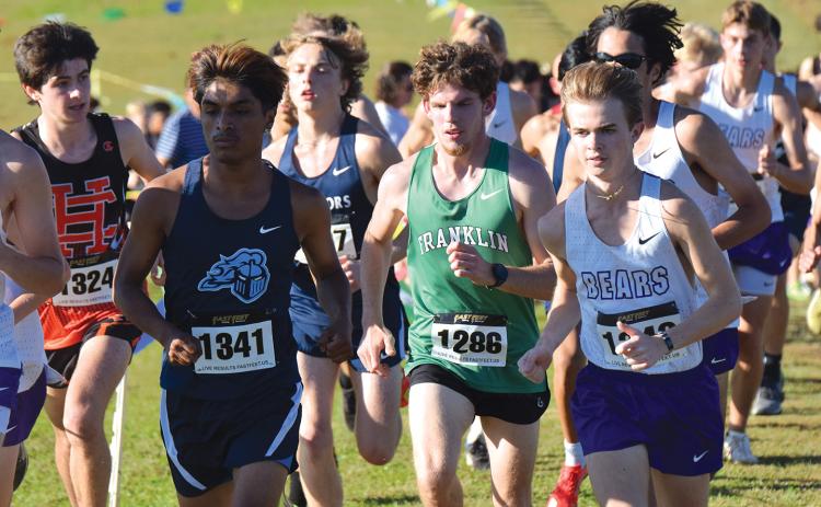 Lion Will Gipson was caught in the field to start Thursday’s race in the Jan Taylor Invitational, but eventually found his way to the front and a victory in the race. (Photos by Shane Scoggins)