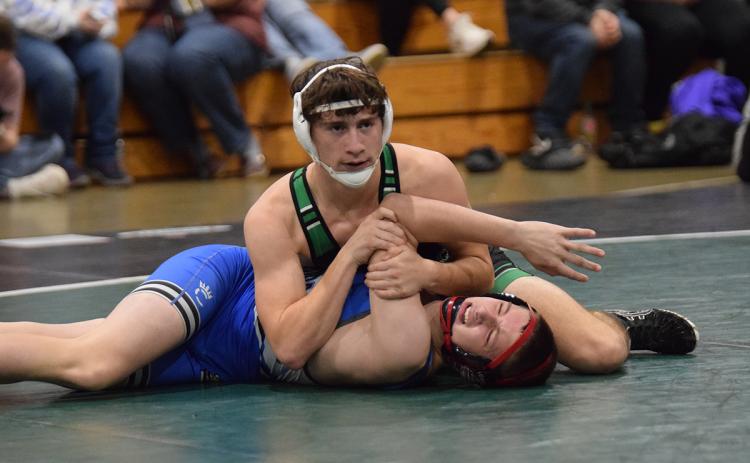 Lion Jacob Henkel works to pin a Banks County opponent during action Tuesday at the wrestling gym in Carnesville. (Photo by Shane Scoggins)