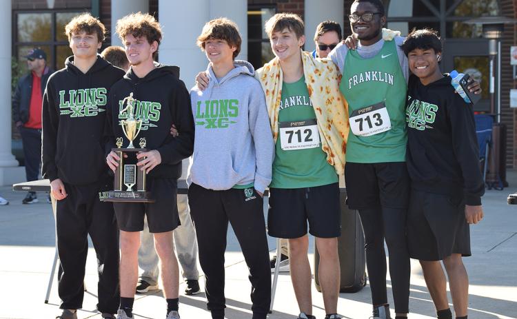The Franklin County Lions (above) took second place in Region 8AA Saturday at the State Sectional Meet. Among those running for the Lions were (above, from left) Evan Locke, Will Gipson, Connor Borum, Justin Whitmire, Trey Willis and Angel Zamora.