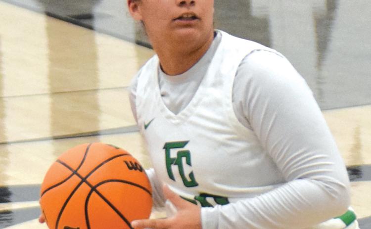 Lady Lion Kallie Thrift looks to make a pass in a game earlier this season.