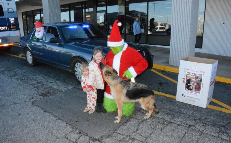 The Grinch and Franklin Springs Police Department K-9 Honor were out Monday collecting Toys for Tots at the Food Lion Shopping Center. Sammy and McKenzie Rafferty came over to say “hi”.