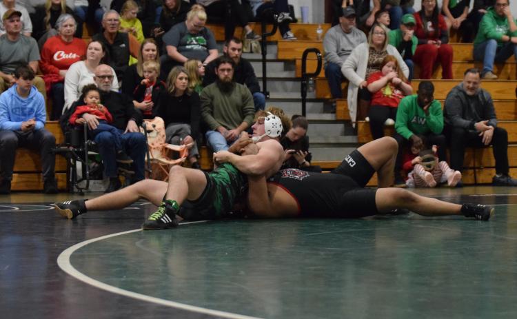 Lion Ramsey Fulbright pins a Rabun opponent in a match earlier this season.