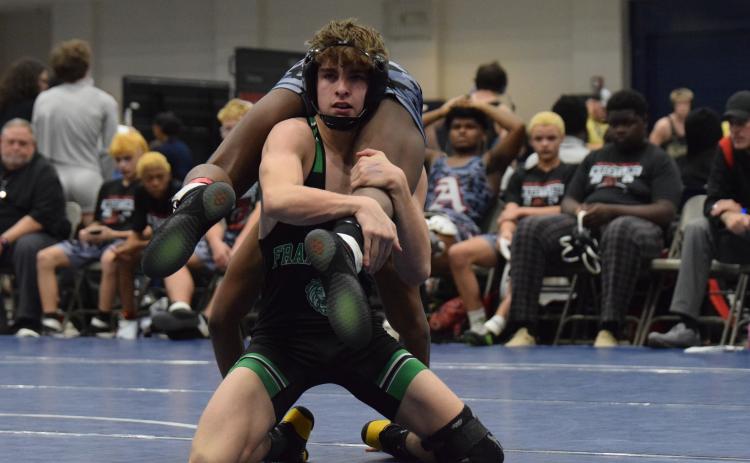 Jaxon Norwood works to finish a takedown against an Appling County opponent Friday in the State Duals Championship at East Jackson High School. (Photo by Shane Scoggins)