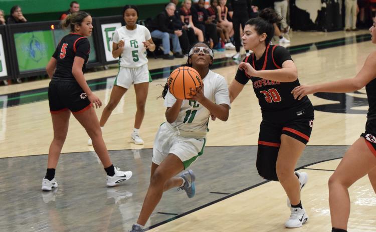 Freshman Jyhia Sturghill drive to the basket for a layup Tuesday against Stephens County. (Photo by Shane Scoggins)
