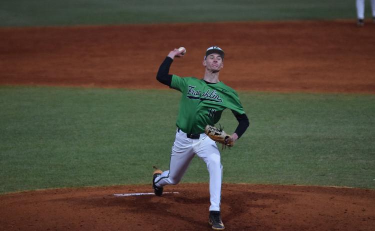 Senior Caden Cawthon delivers a pitch in Franklin County’s season-opening 11-1 win over Washington-Wilkes Monday in Carnesville. (Photo by Shane Scoggins)