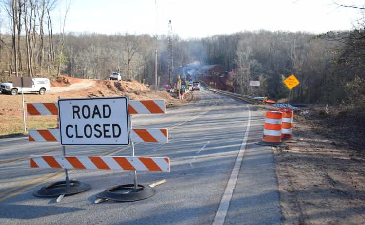 Georgia Highway 106 was closed Tuesday at the Madison County line to replace the bridge over the Hudson River.