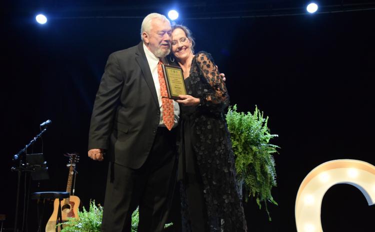 Sid Ginn hugs Franklin County Chamber of Commerce Director Rachel Howington after receiving the Charles E. Bradshaw Citizen of the Year Award.
