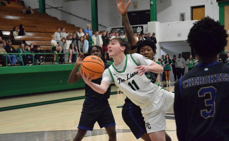 Senior Bentley Huff puts up a shot in Franklin County’s round one win over Kendrick last week in the Lions Den. (Photo by Shane Scoggins)