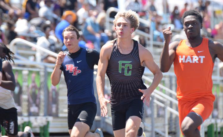 Carson Cheek competes in the 100 meter dash at Saturday's John Scott Hartness Invitational at FCHS. The Lions won first place in the meet over a field of 13 other competitors.