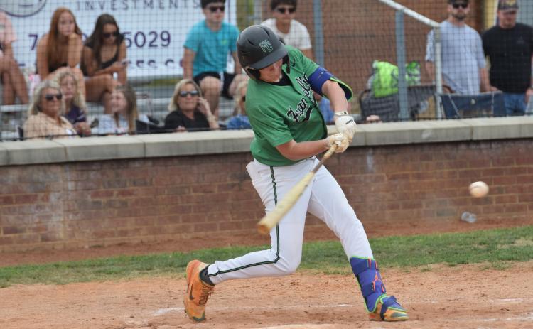 Hudson Huff swings at a pitch during the Lions' first round baseball playoff game against Union County in Blairsville.
