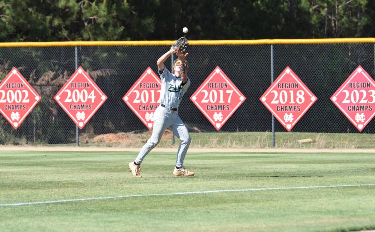 Gavin Holman makes a catch in rightfield during a state semifinal game at Morgan County Thursday. (Photo by Shane Scoggins)