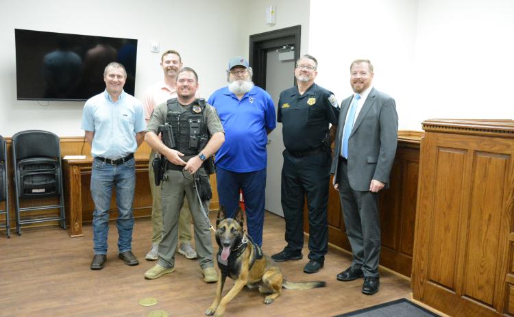 Attending a press conference to introduce the Lavonia Police Department’s new K9 Lobo are (from left) Lavonia City Council Member Jeremy Madden, Andrew Murphy, K9 handler Corporal Justin Parten, Richard Roberts, Police Chief Shane Edmisten and Mayor Courtney Umbehant. (Photos by Charlie Eavenson)