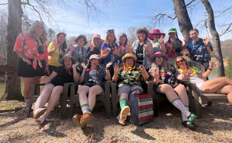 Taking part in a scrapbooking retreat on Lake Hartwell earlier this year were (front, from left) Helena Barfield, Emma Barfield, Nancy Rowland, Darlene Eades, Michelle Covel, (back) Kelly Barfield, Karen Turner, Tonya Bunch, Donna Ialungo, Debbie Tardella, Donna Goenner, Cheyney Morgan, Andrea Raphael, Victoria Richardson and Audrey Covel.