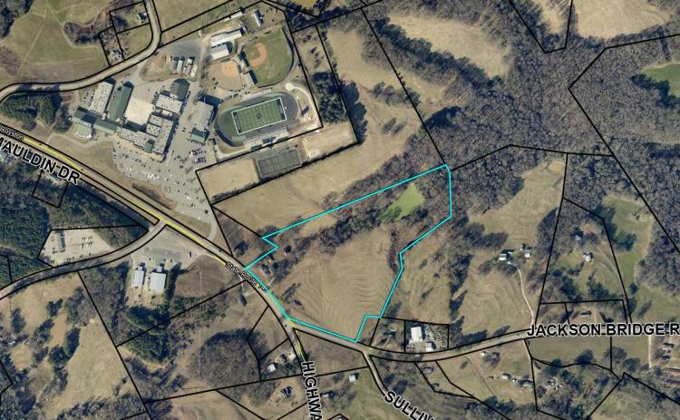 The Franklin County Board of Education voted Thursday to buy 21.54 acres to add to the campus at FCHS. 