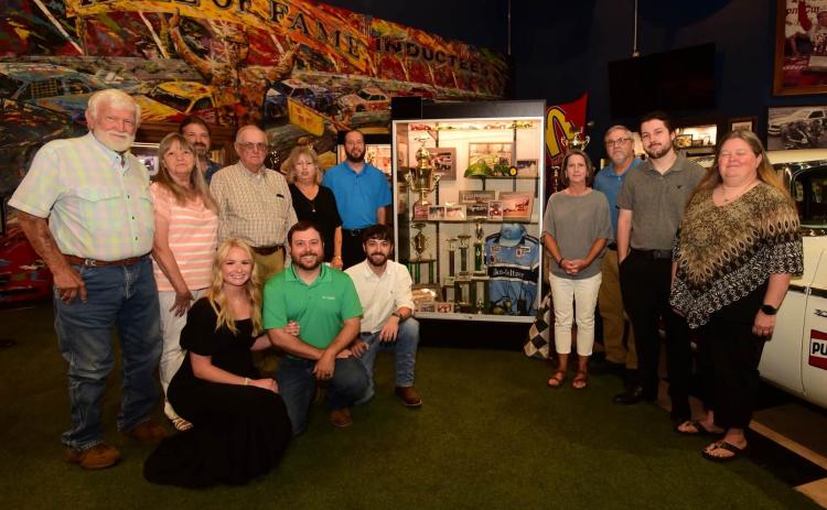 Gerald Voyles’ family and supporters gathered Saturday at his display after he was inducted to the Georgia Racing Hall of Fame at 415 Highway 53 East in Dawsonville. The museum is open Monday through Saturday from 10 a.m. until 5 p.m. and Sunday from 1-5 p.m. (Photo by Tom Reed, courtesy of the Georgia Racing Hall of Fame)