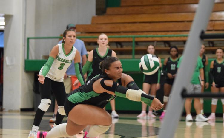 Senior Kallie Thrift digs a ball Tuesday in action against Rabun County in the Lion’s Den. Thrift and the Lady Lions swept Rabun and East Jackson in the three-team match. (Photo by Shane Scoggins)