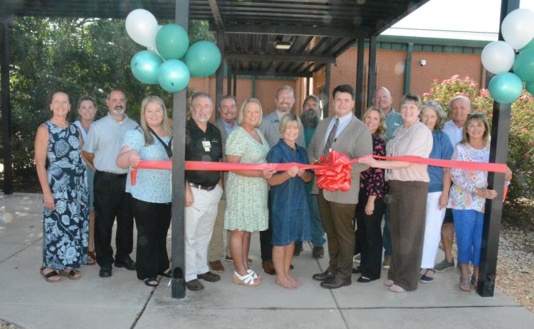 The Franklin Campus of Mountain Education Charter High School held a ribbon cutting and open house for its new location on the campus of Franklin County High School on Monday. The Franklin County Chamber of Commerce assisted with the celebration. Those attending were (from left) Rachel Howington, Claudette Gillespie, Scott Rhinehart, Brooke Dove, Darren Sledge, Steve Bartlett, Lydia Bennett, Dr. Joe Cash, Melanie Burton-Brown, Benjamin Khodadadi, Dr. Andrew Fowler, Dr. Kaila Steele, Bruce Brown, Dr. Kellie 