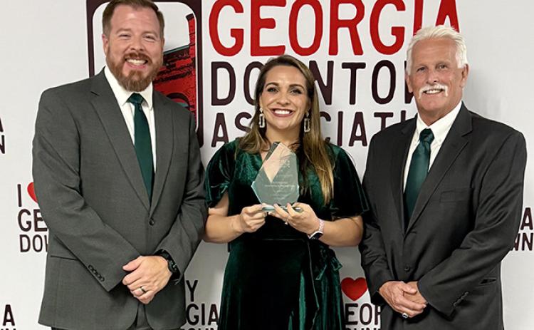 Lavonia Mayor Courtney Umbehant (left), Downtown Development Director Ashley Rose Umbehant (center) and City Manager Robert Ogburn (right) accepted the Outstanding Downtown Promotion Award during the Georgia Downtown Conference in Rome last week. (Photo courtesy of the City of Lavonia)