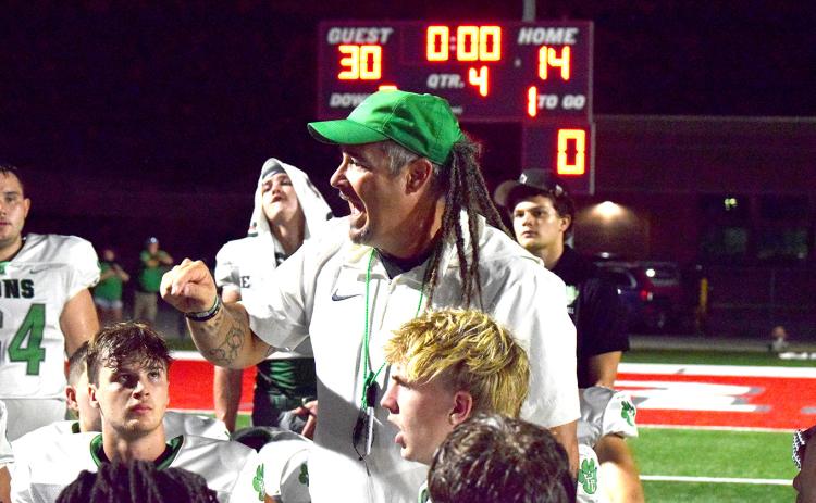 Coach Chuck Holland tells his team how proud he is of them after the Franklin County Lions defeated Madison County 30-14 Friday in Danielsville. (Photos by Shane Scoggins)