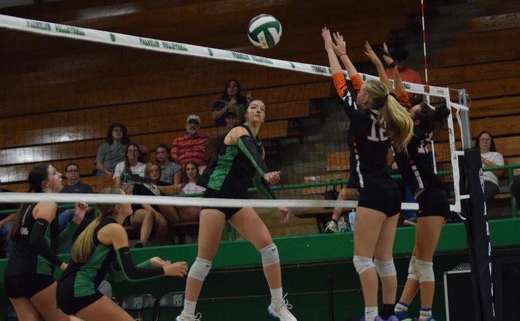 Anna Weathers spikes a ball for a point against Hart County Tuesday in the Lion’s Den. (Photo by Shane Scoggins)