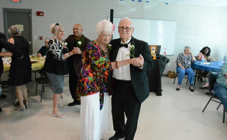 Patty McAllister and Hoyt Butler (back left couple) and Pauline Segars and Richard Turner took the opportunity to “cut a rug.”