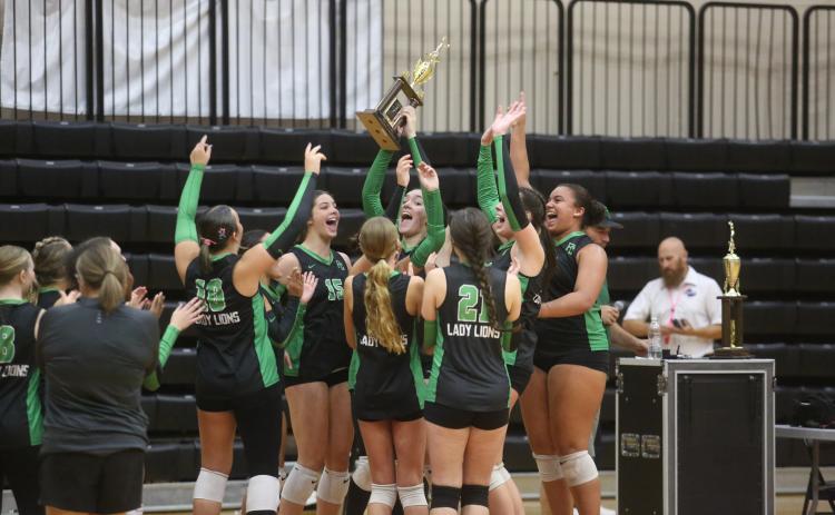 The Franklin County Lady Lions celebrate a second-place finish in the Region 8AAA volleyball tournament Thursday at Emmanuel University. Franklin has finished as the top public school in the region for two straight seasons. (Photos by Rose Scoggins)