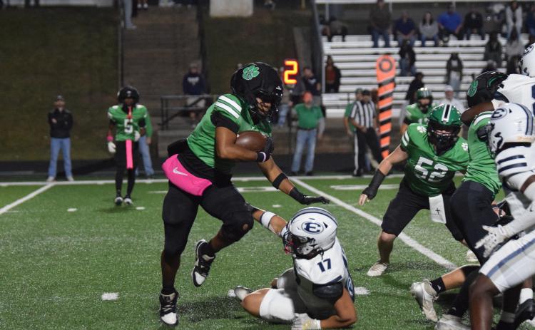 Senior Gavin Wells avoids an Elbert County tackler Friday in a Region 8AAA contest at Jeff Davis Field at Ed Bryant Stadium. Wells led Franklin offensively and defensively with a fumble recovery, interception and by throwing a touchdown pass. (Photos by Shane Scoggins)