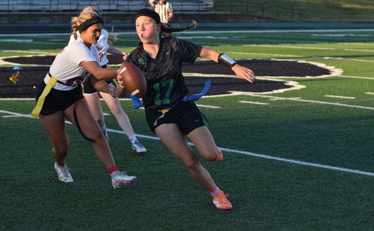 Allie Duncan avoids a flag pull Tuesday during a 35-0 win over Stephens County in the first home game for the Franklin County’s new flag football program. (Photo by Shane Scoggins)
