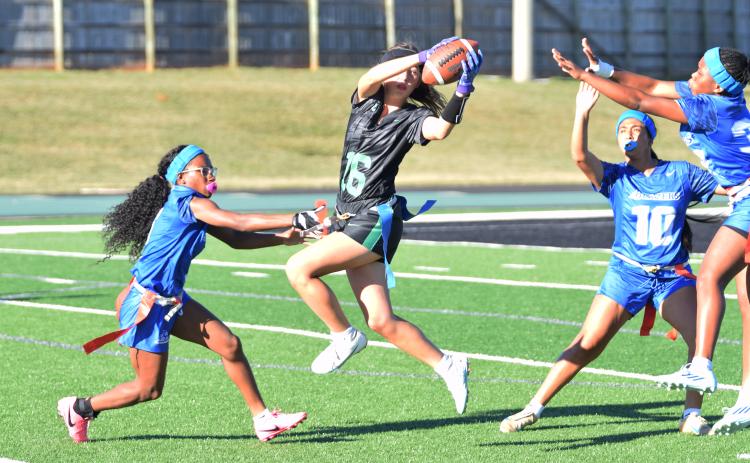 Kate Finger goes up for a catch against BASA in an area flag football game Thursday at Jeff Davis Field at Ed Bryant Stadium. (Photos by Shane Scoggins)