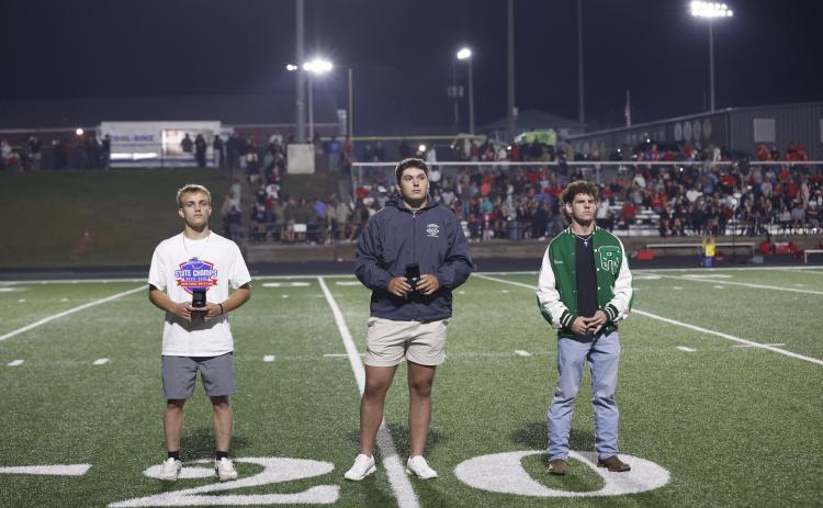 Championship rings were presented Friday to (from left) Josh Baughcum, Candler Stone and Will Gipson for state championships won during last school year.